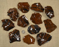 Small spalls and flakes of mahogany obsidian for flintknapping