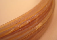 close up of twisted gut hafting material