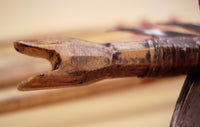 close up of hand carved nock on traditional arrow