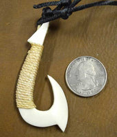 hand carved bone hook pendant
