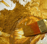 dark yellow natural earth ochre pigment in liquid
