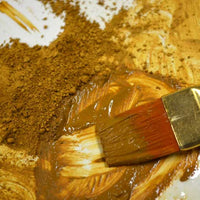 dark yellow natural earth ochre pigment in liquid
