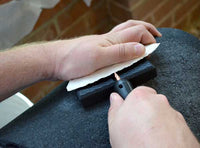 pressure flaking on the knee with a delrin flaker tool