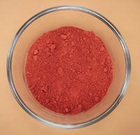 Natural dark red earth ochre pigment paint