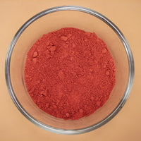 Natural dark red earth ochre pigment paint