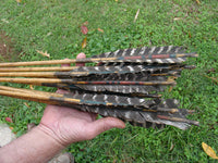 fletching of turkey feathers on traditional scout award arrows