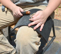 flint knapping suing the rubber leg pad tool and supplies