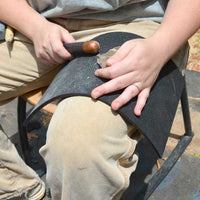 flint knapping suing the rubber leg pad tool and supplies