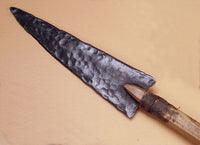 forged metal trade point attached on scout award arrow