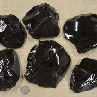 Examples of black obsidian rock spalls