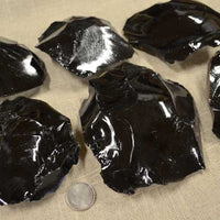Black obsidian 3-6 inch spalled pieces of rock