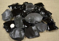 pile of obsidian and dacite small spalls and flakes
