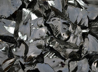 glossy texture of black obsidian stone