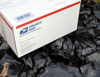 Large box of black obsidian stone for flintknapping