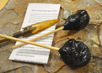 two globs of natural pine sap resin glue