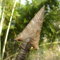 hand chipped stone arrowhead point on award arrow