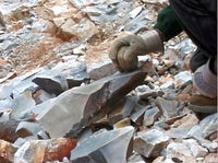 Spalling raw chert block with hammerstone