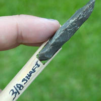 Side view of stone indian arrowhead