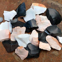 spread of small stone spalls and rock flakes for flintknapping material