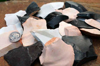 detail view of flintknapping stone small spalls and flakes mix