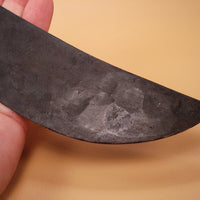 Close up of hammer imprints on knife blade