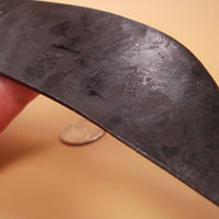 detail of forged pitting on metal knife blade