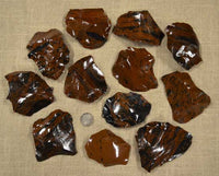 Small spalls and flakes of mahogany obsidian for flintknapping
