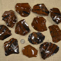 Small spalls and flakes of mahogany obsidian for flintknapping