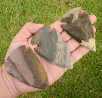 three large spear points made from indian jasper stone
