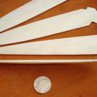 thickness of hand carved bone spear point