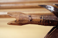 side view of hand carved nock and hafting of traditional arrow
