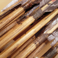 natural sinew hafting and hand carved wood arrow shafts