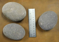 three larger hammerstone tools for percussion flintknapping
