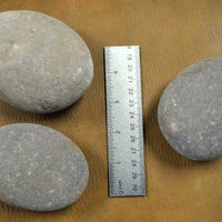 three larger hammerstone tools for percussion flintknapping