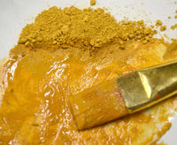 bright yellow earth ochre pigment with liquid
