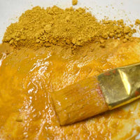 bright yellow earth ochre pigment with liquid