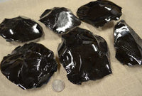 Black obsidian 3-6 inch spalled pieces of rock
