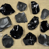 small spalls and flakes of obsidian and dacite stone for flintknapping