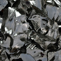 glossy texture of black obsidian stone