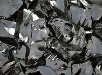 glossy texture of black obsidian stone
