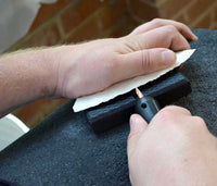 Pressure flaking using the rubber hand pad flintknapping tool
