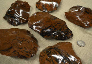 multiple spalls of mahogany obsidian flint knapping stone