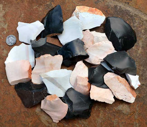 spread of small stone spalls and rock flakes for flintknapping material