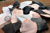 detail view of small flintknapping spalls and rock flakes for stone tool making
